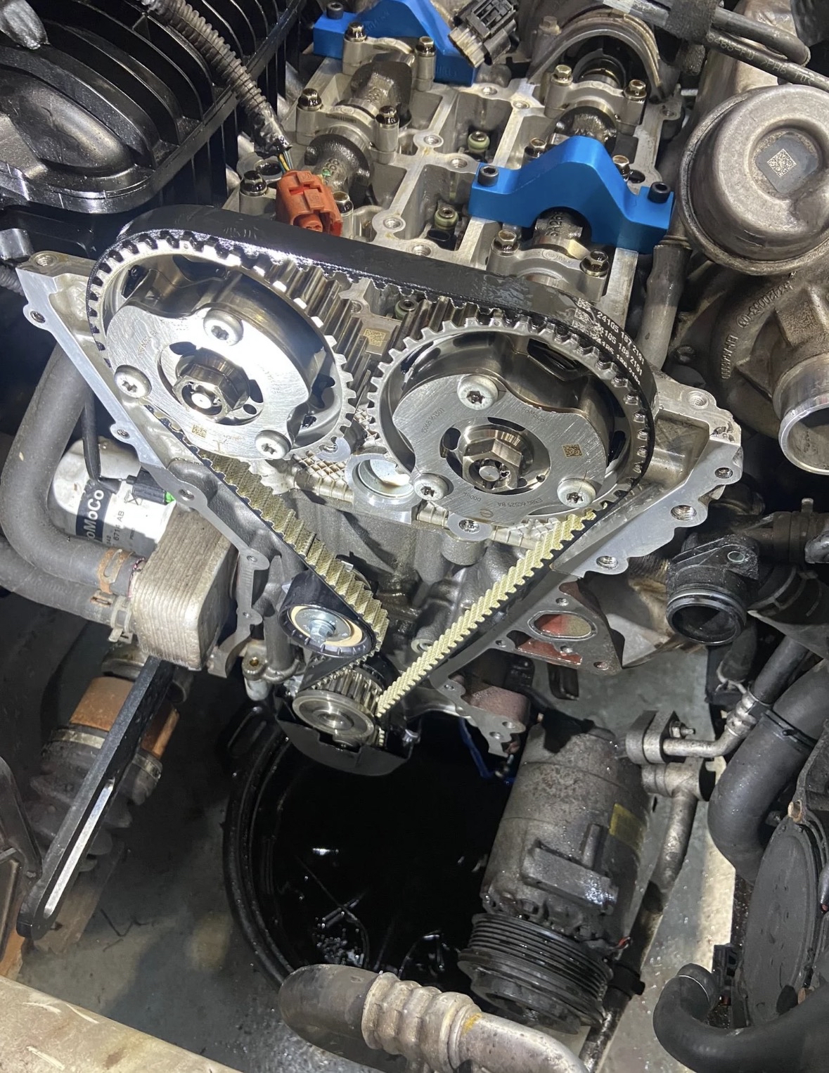 Wet timing belt inside engine